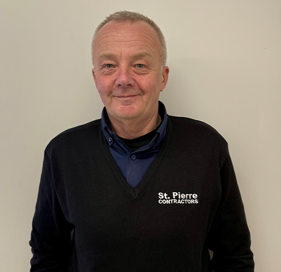 middle-aged man with beard wearing navy shirt smiling against plain background 4 tips for happiness